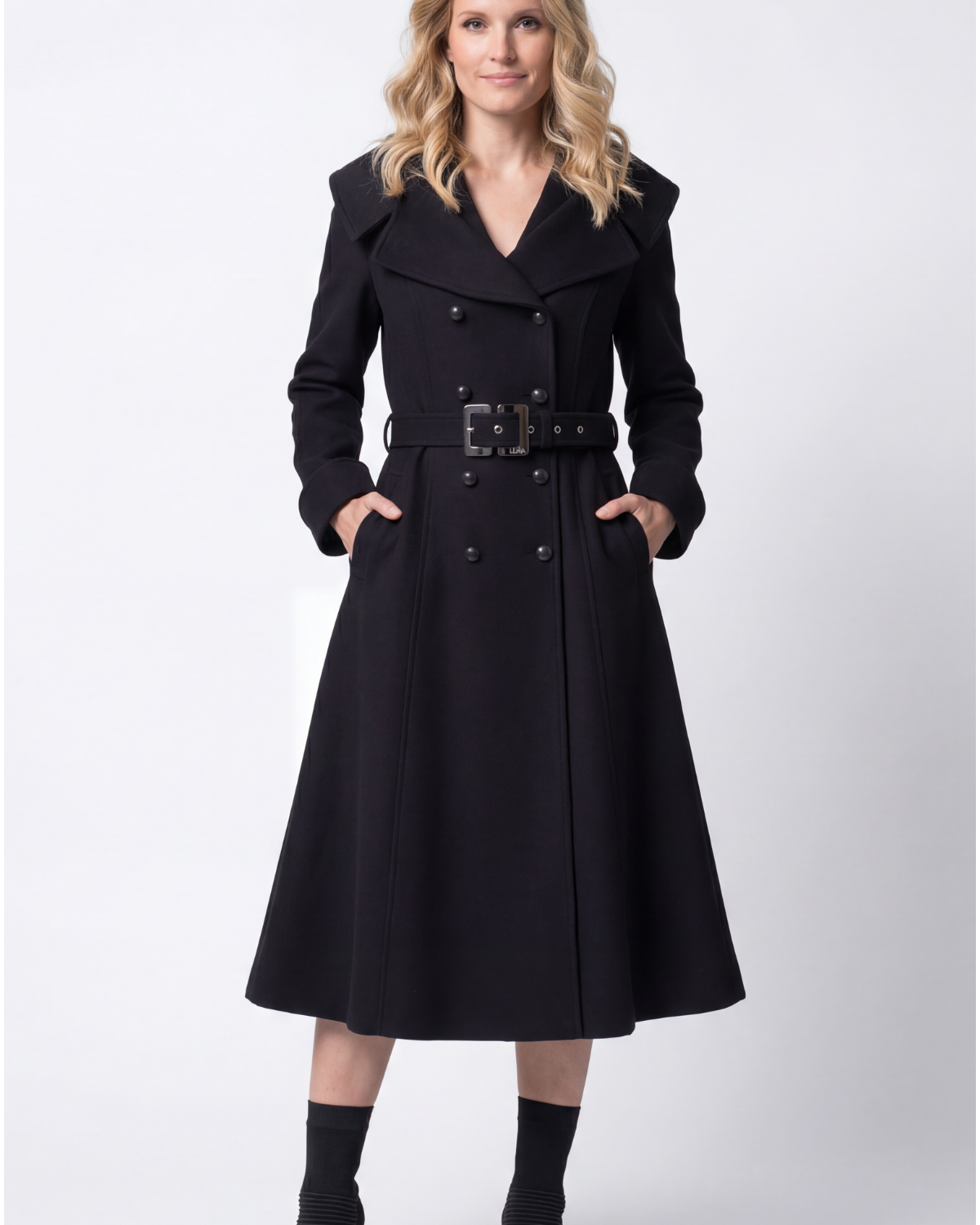Black 480gsm long-fiber wool wrap coat with self-fabric tonal belt and horsehair canvas lapels, photographed on a neutral background