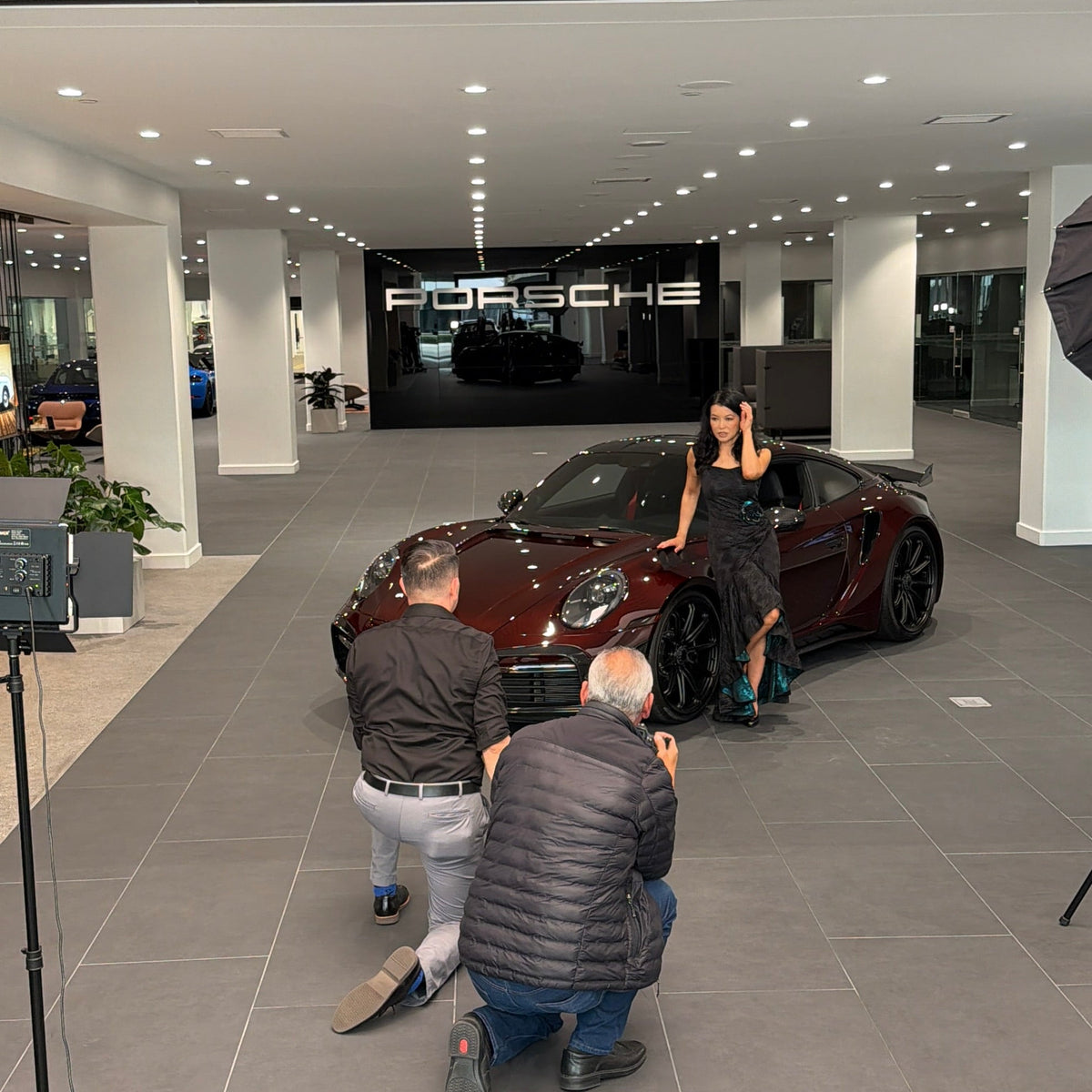 Luna Fashion House editorial shoot with Porsche at Porsche Downtown LA, featuring the Porsche 911 Turbo S