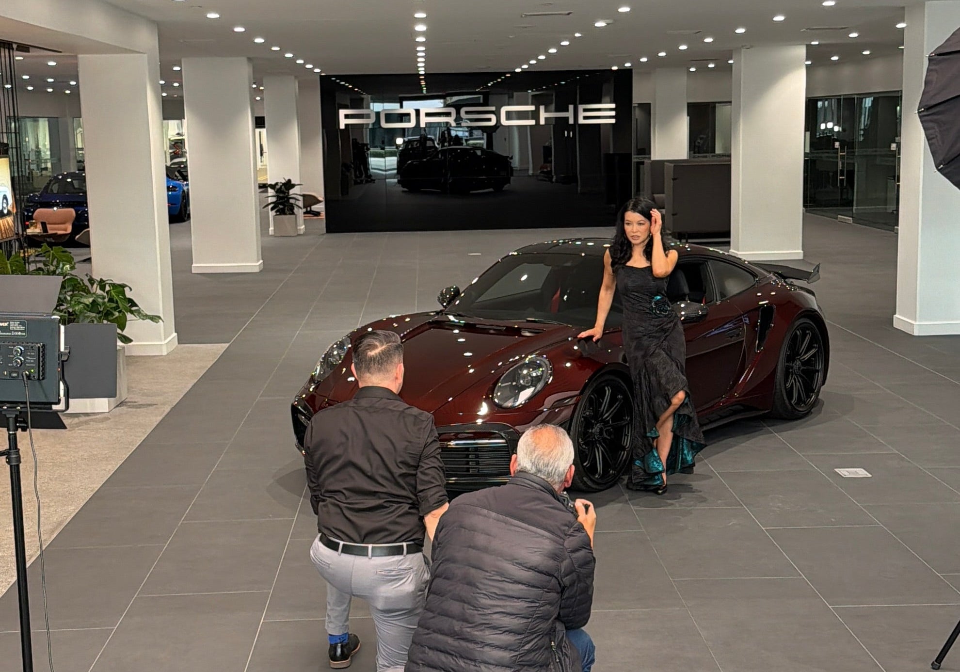 Luna Fashion House editorial shoot with Porsche at Porsche Downtown LA, featuring the Porsche 911 Turbo S