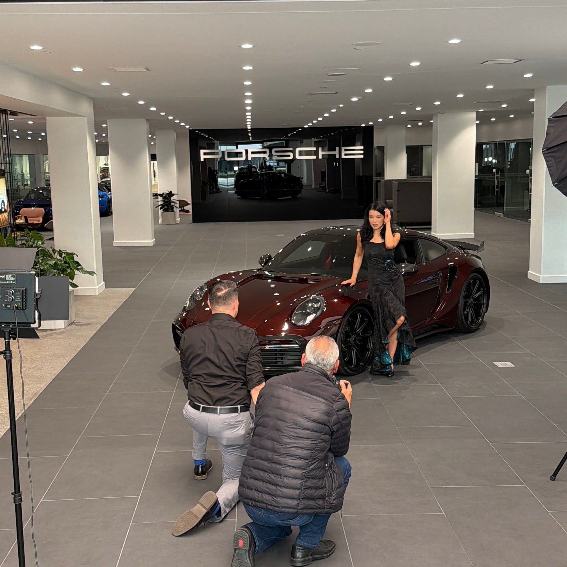 Luna Fashion House editorial shoot with Porsche at Porsche Downtown LA, featuring the Porsche 911 Turbo S