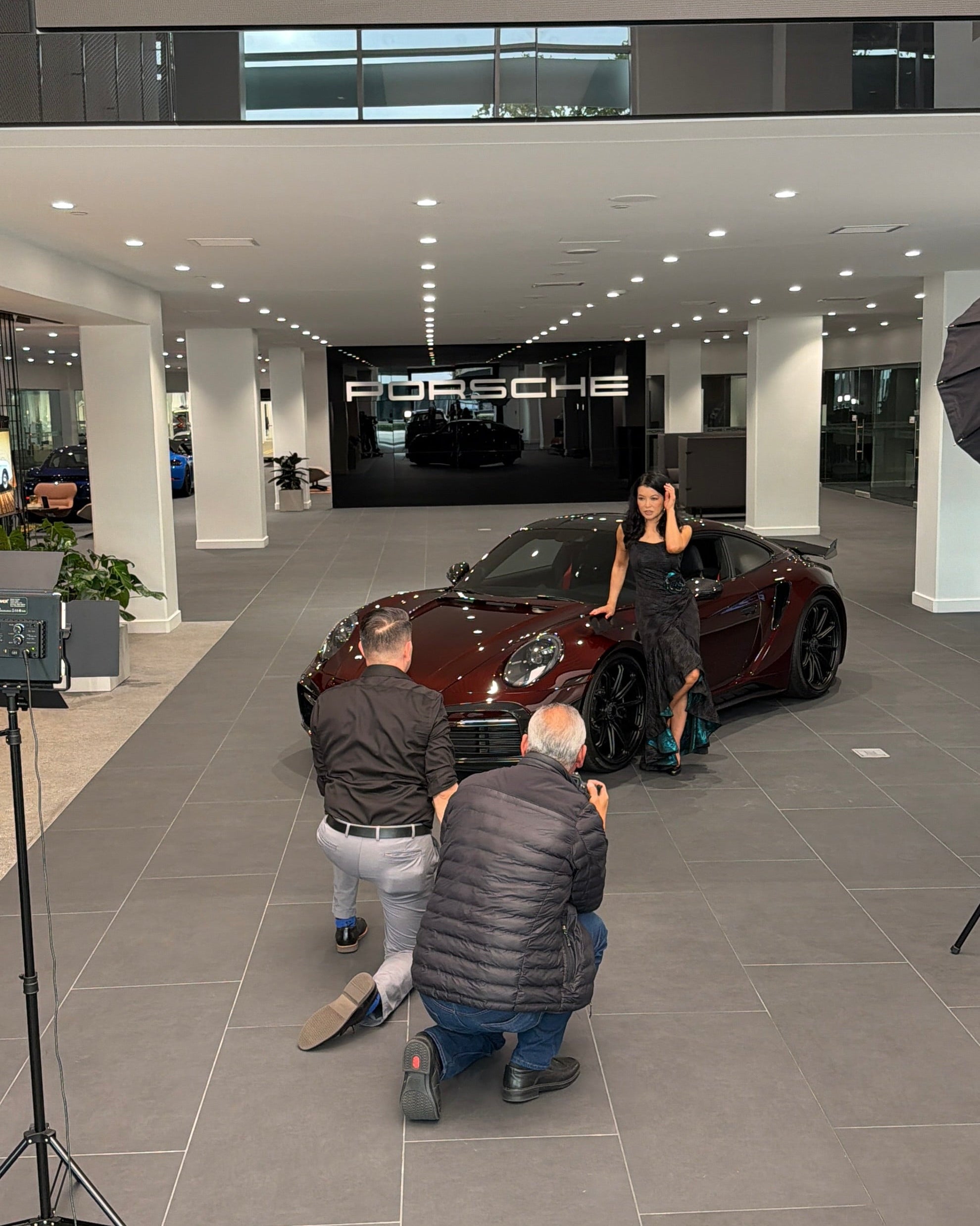 Luna Fashion House editorial shoot with Porsche at Porsche Downtown LA, featuring the Porsche 911 Turbo S