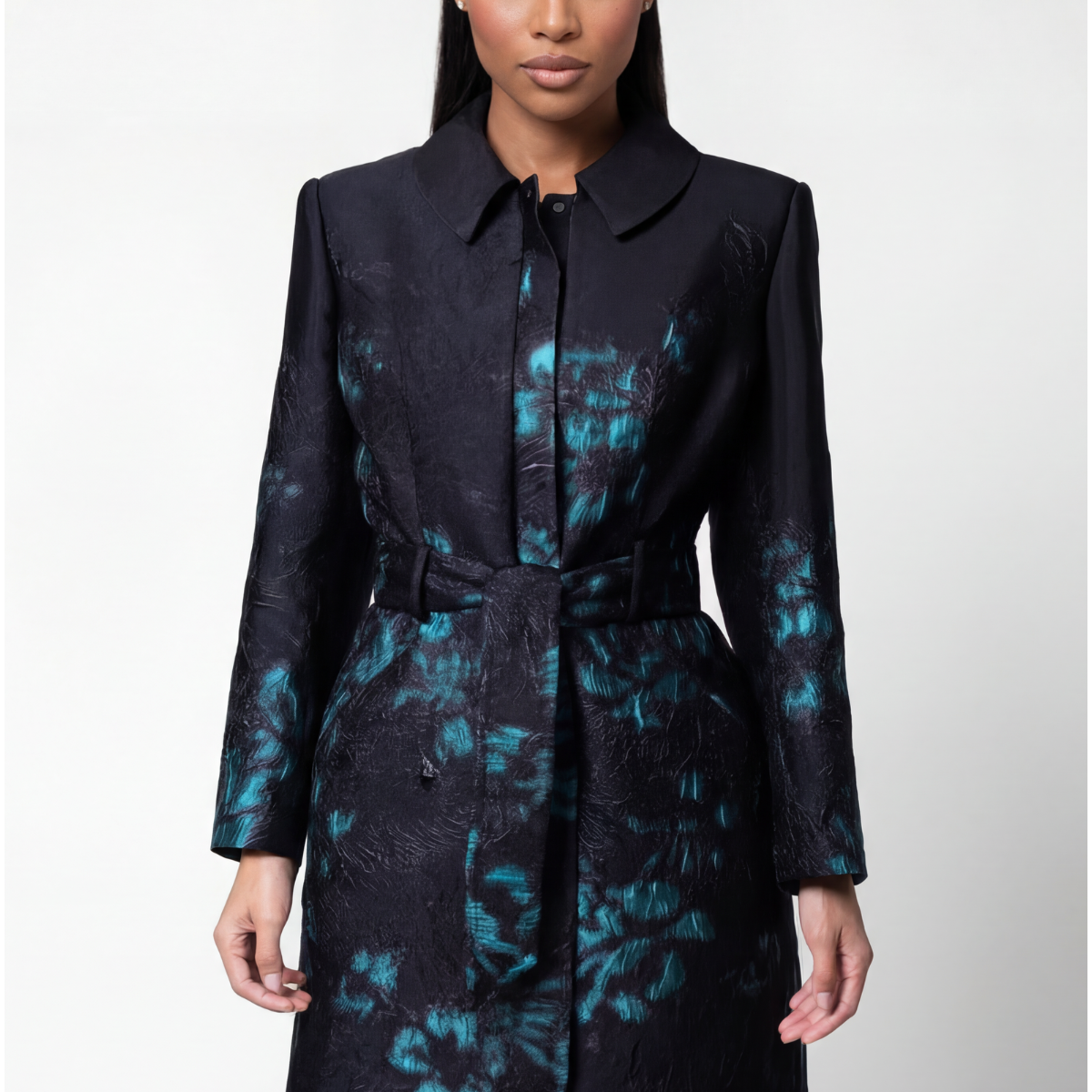 Black light coat with teal floral jacquard, shirt collar, tie belt at the waist, and knee-length skirt, by Luna Fashion House