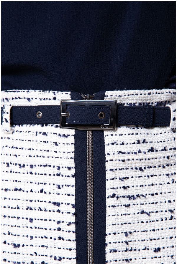 Close up of navy belt and zipper on white tweed pencil skirt
