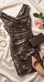 Bronze metallic cocktail dress styled on ivory satin with nude pumps, bronze clutch, gold earrings, and a pale rose