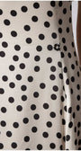 Close-up of Melissa Satin Midi Dress in White Pokadot showing silky texture and distinctive black polka dot pattern from Luna Fashion House