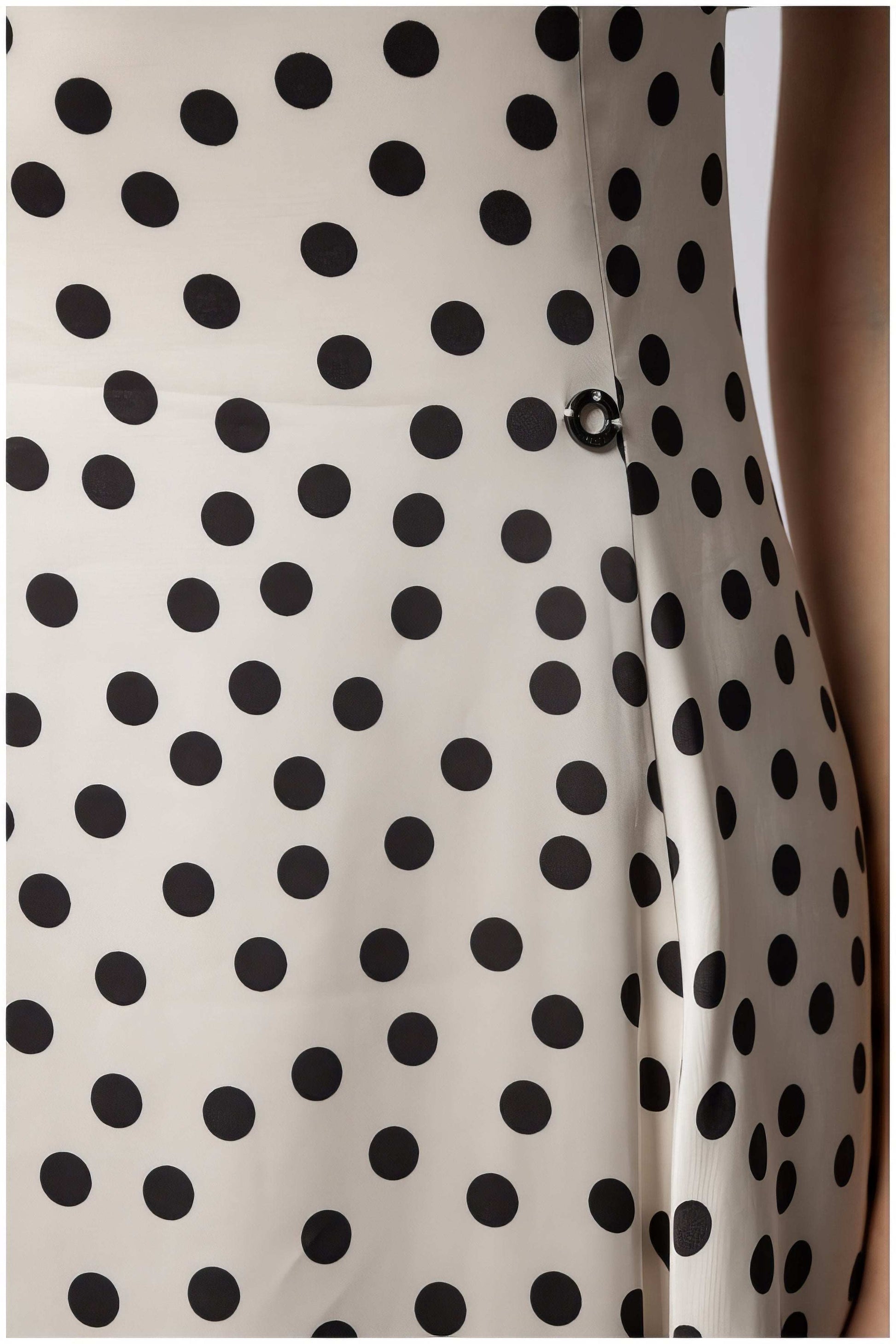 Close-up of Melissa Satin Midi Dress in White Pokadot showing silky texture and distinctive black polka dot pattern from Luna Fashion House