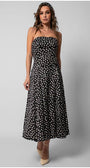 Model wearing a black elegant midi dress black and ivory polka dot strapless satin midi dress with a fitted bodice and flowing skirt