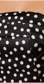 Close-up of black fabric with white polkadots on the Melissa Strapless Dress in White Pokadot from Luna Fashion House