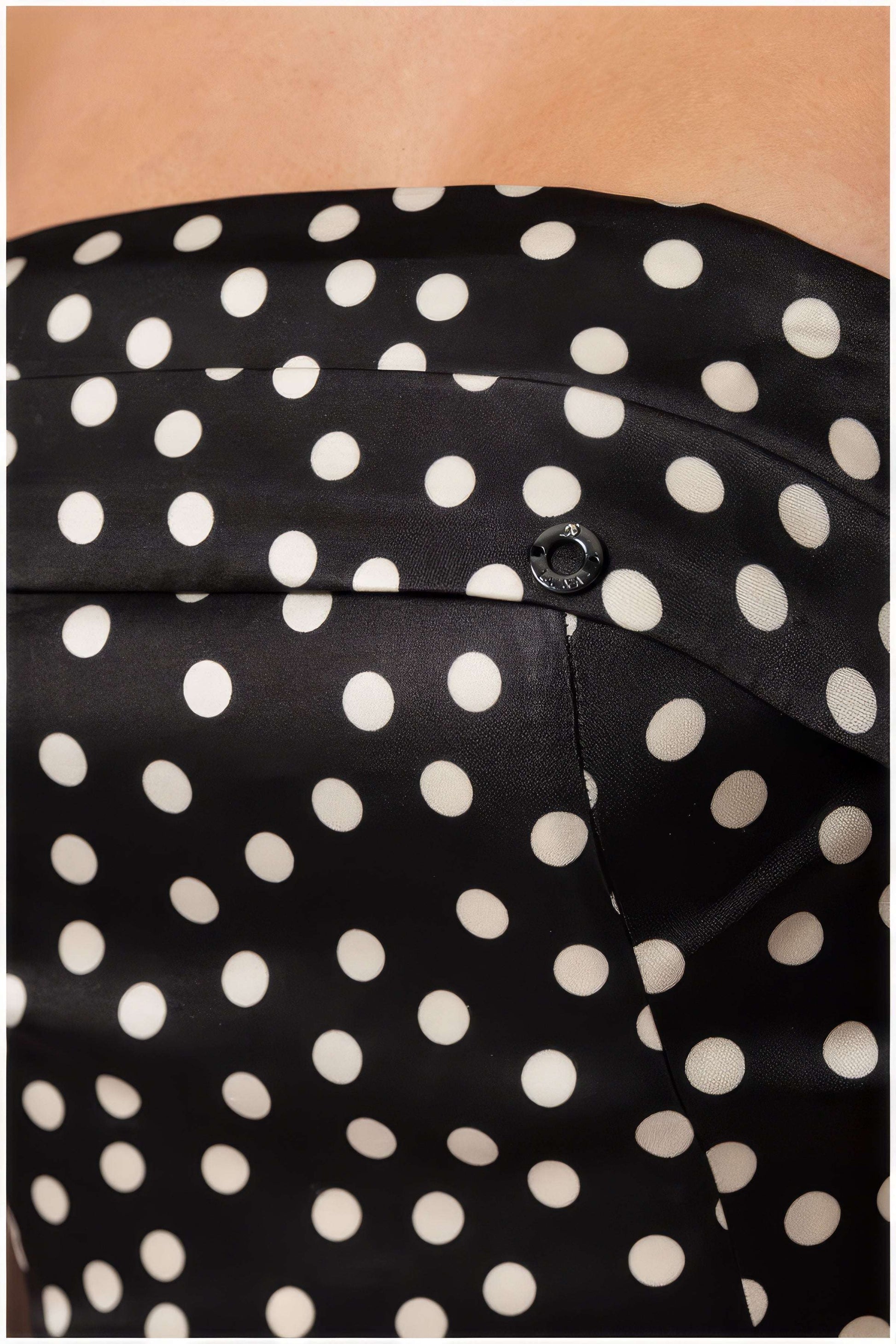 Close-up of black fabric with white polkadots on the Melissa Strapless Dress in White Pokadot from Luna Fashion House