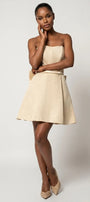 Front model view of Melisa beige strapless corset mini dress with defined waist and flared skirt.