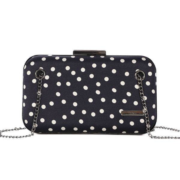 Black structured shoulder bag Melissa with white polka dots and detachable silver chain strap on white background.