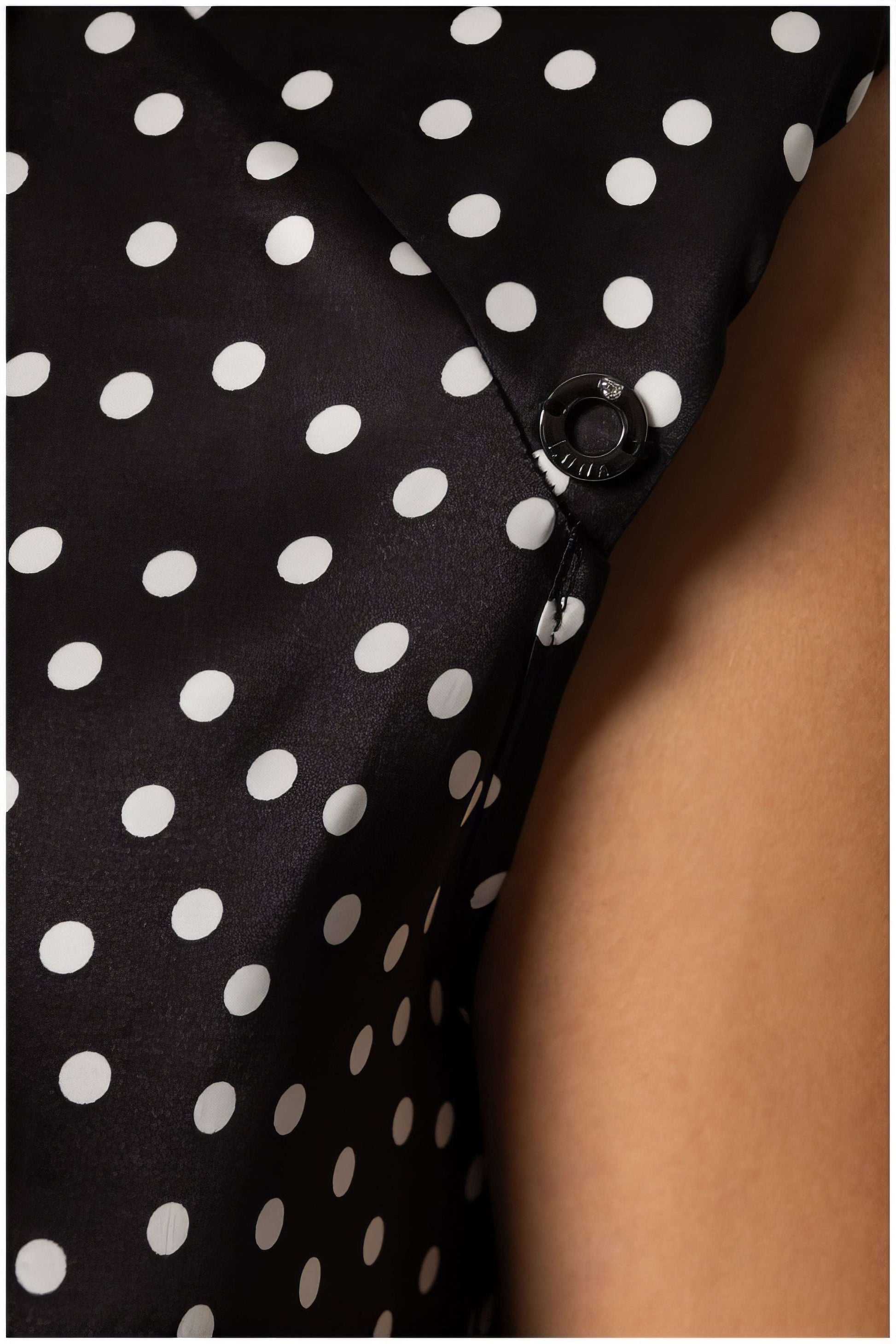 Close-up of Talia Satin Blouse in Black Pokadot showing smooth satin fabric and fine polka dot pattern detail