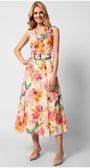 Woman wearing sleeveless colorful floral elegant midi dress with belted waist and flowing silhouette standing against white background