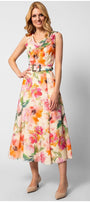 Woman wearing sleeveless colorful floral elegant midi dress with belted waist and flowing silhouette standing against white background