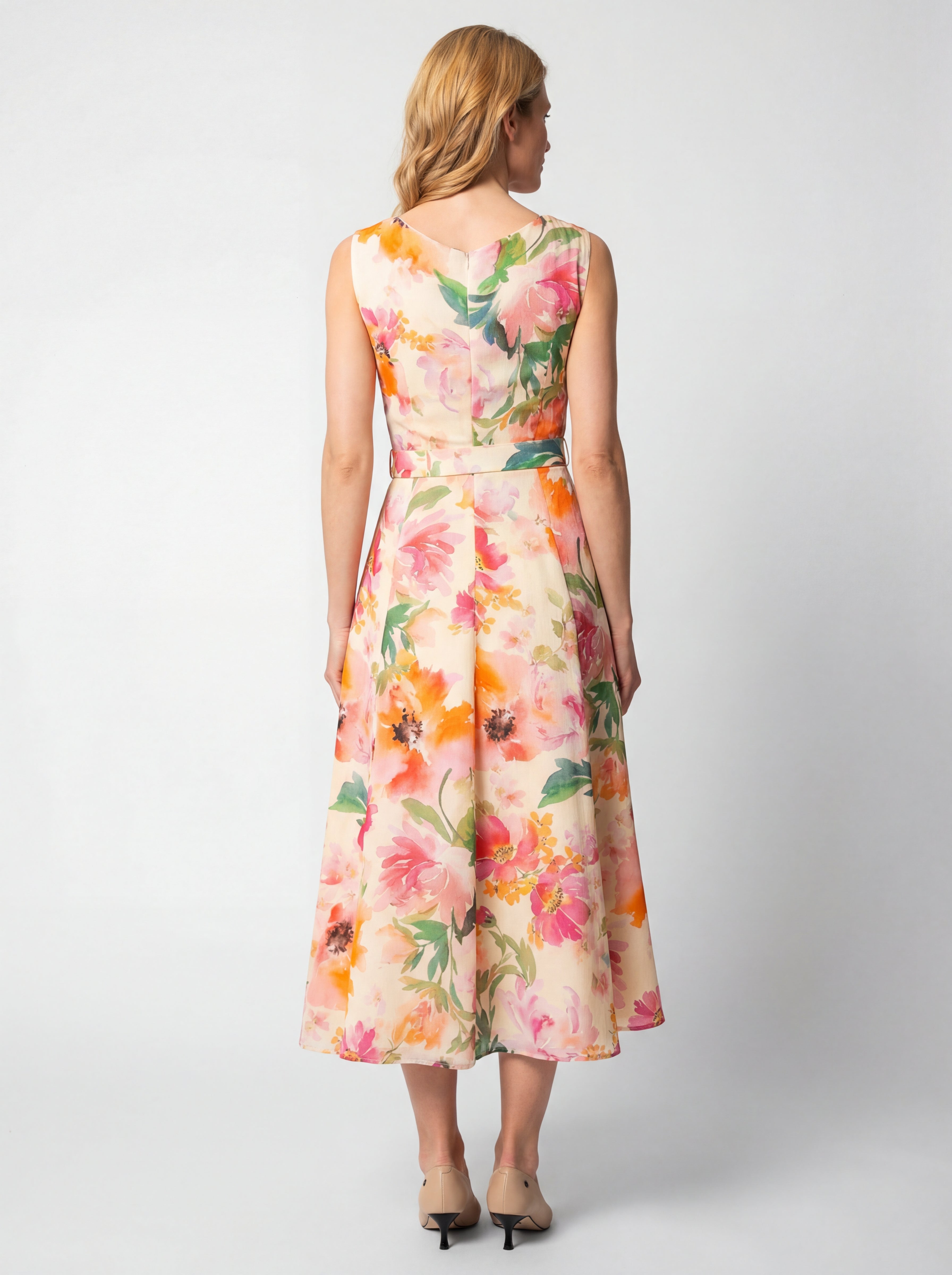 Amanda by Luna Fashion House floral midi dress back view showcasing precise tailoring, midi length, and sophisticated print detail in white professional studio setting.