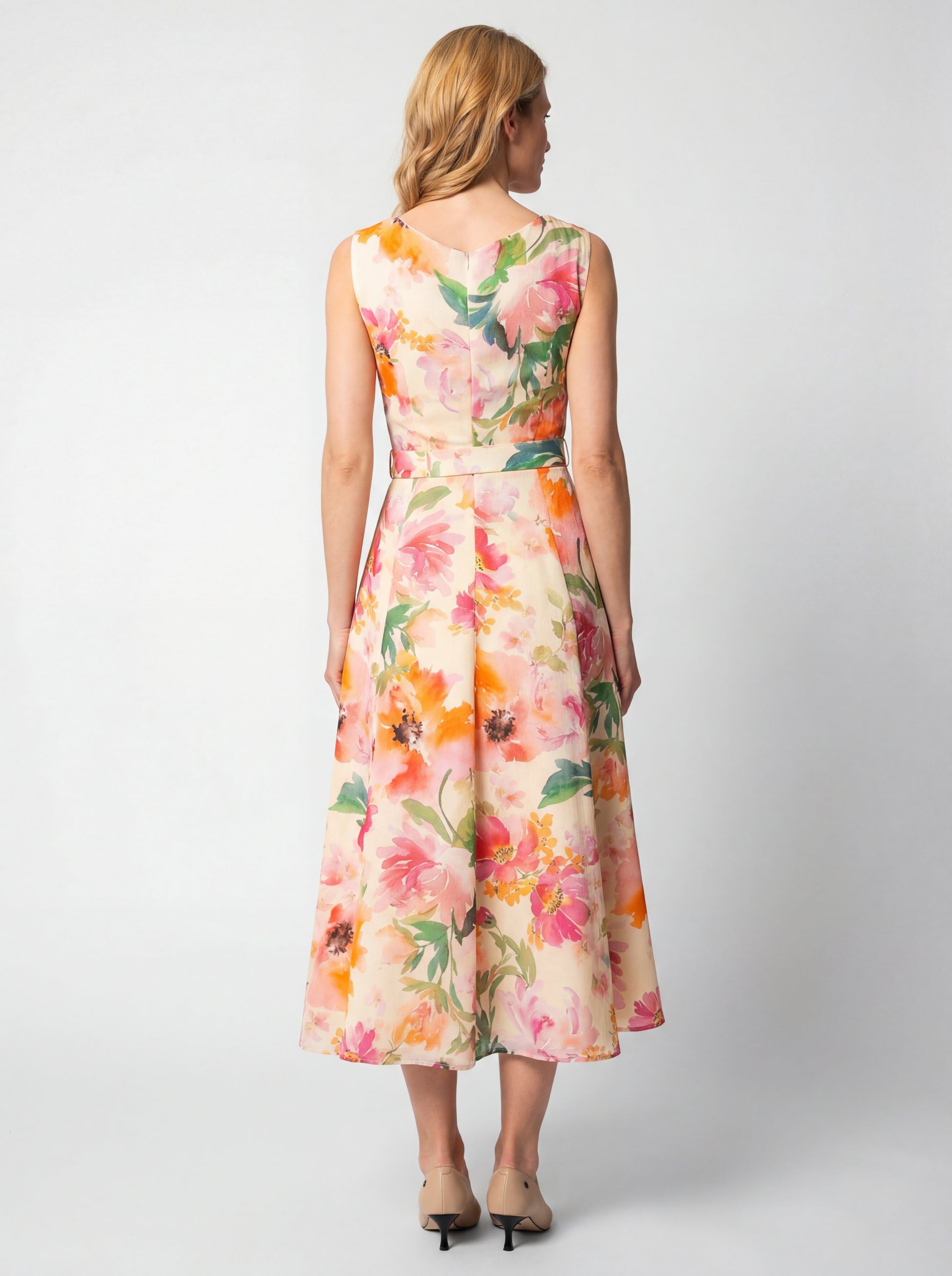 Amanda by Luna Fashion House floral midi dress back view showcasing precise tailoring, midi length, and sophisticated print detail in white professional studio setting.