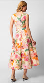 Woman wearing sleeveless floral elegant midi dress with belted waist and flowing skirt, photographed from the back