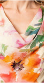 Close-up of vibrant floral print on soft viscose fabric of Amanda Midi Dress with draped neckline detail