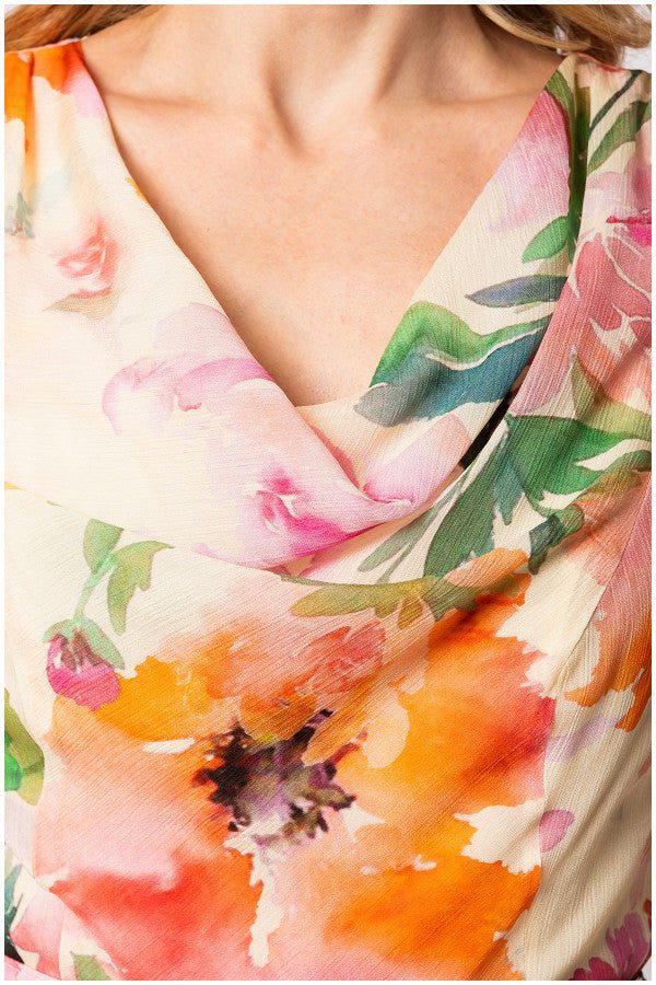 Close-up of vibrant floral print on soft viscose fabric of Amanda Midi Dress with draped neckline detail