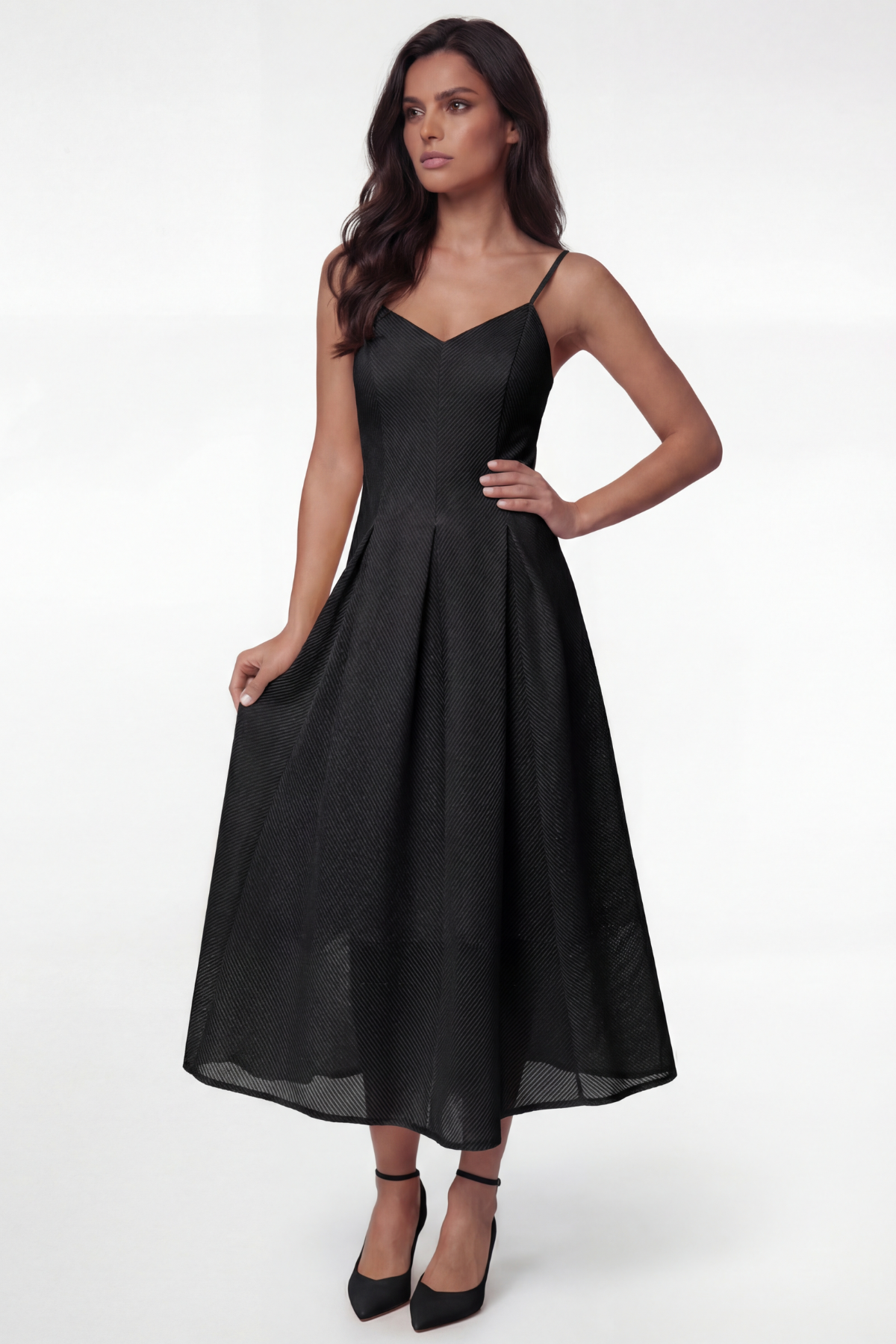 Woman wearing a black dress on a white background