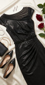 Morgan Short Dress styled on ivory satin with black patent pumps, black clutch, crystal earrings, and red roses