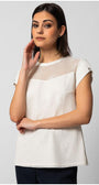 Woman wearing white short-sleeve TOP ARIA blouse with sheer neckline panel and textured finish