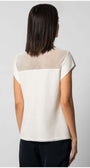 Back view of a woman wearing the Aria Short-Sleeve Blouse in White with mesh detail on the upper back.