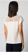 Woman wearing white Top Aria blouse with sheer paneling on back and short sleeves