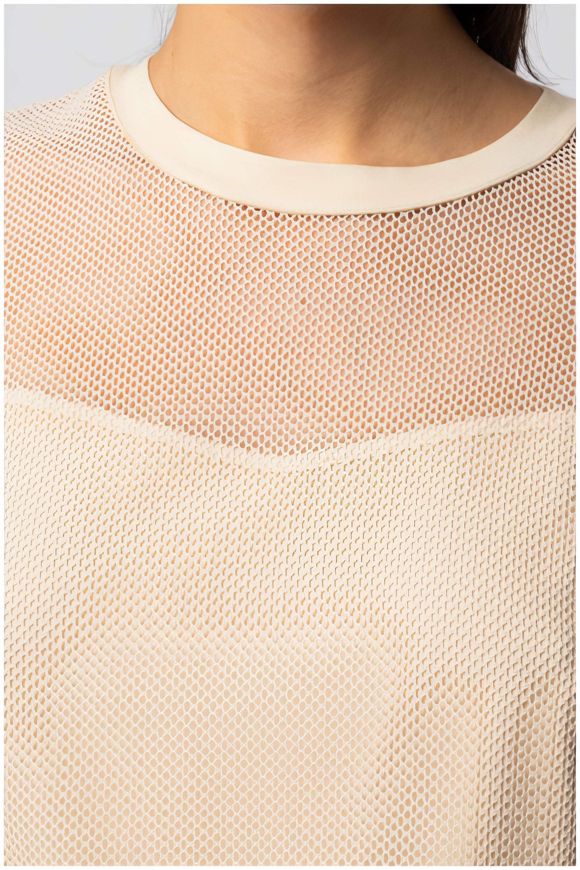 Close-up of the mesh detail and neckline on the Aria Short-Sleeve Blouse in Ivory, showcasing texture and design.