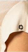 Close-up of elegant womens short sleeve blouse in beige with textured and sheer panel detailing
