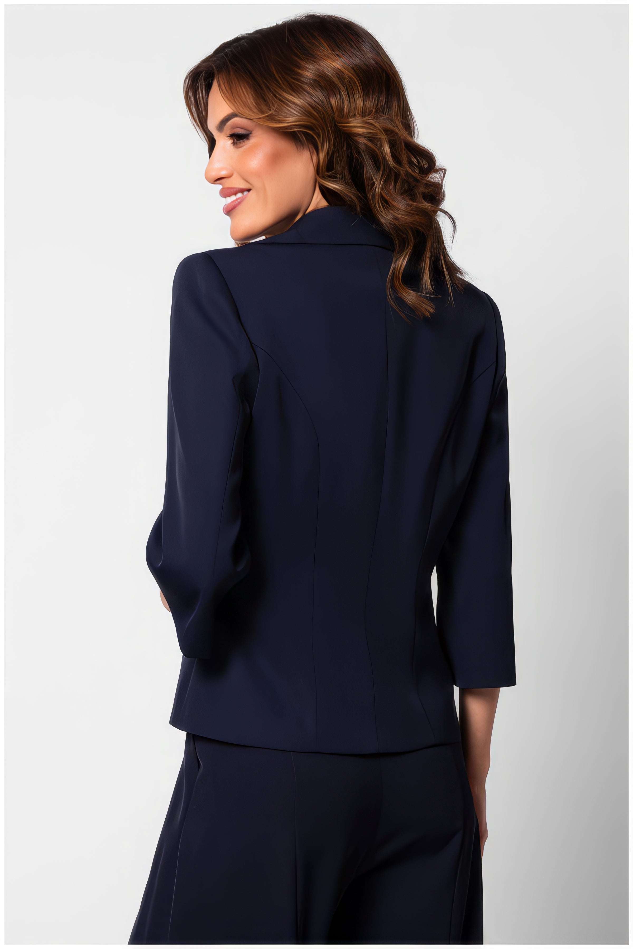 Woman wearing Alexa Tailored Blazer in Navy showcasing the back design with 3/4 sleeves in elegant fit