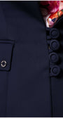 Close-up of button detail and pocket on Alexa Tailored Blazer in Navy with floral lining visible inside collar.