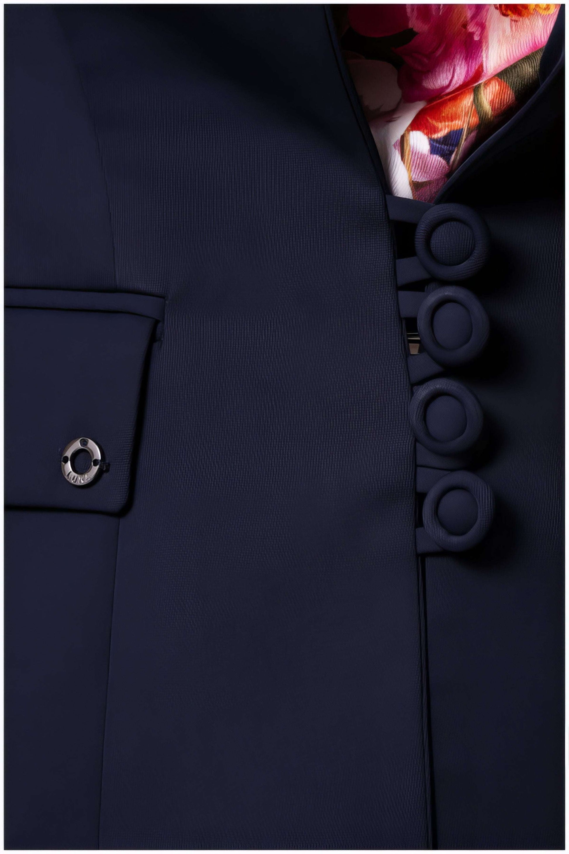 Close-up of button detail and pocket on Alexa Tailored Blazer in Navy with floral lining visible inside collar.