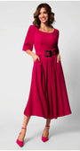 Woman wearing a vibrant fuchsia Charlotte Elegant Midi Dress with elbow sleeves and a black belt, smiling confidently