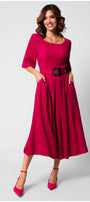 Woman wearing a vibrant fuchsia Charlotte Elegant Midi Dress with elbow sleeves and a black belt, smiling confidently