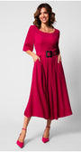 Woman wearing a vibrant elegant midi dress with square neckline, short sleeves, pleated skirt, and wide belt with sculpted buckle