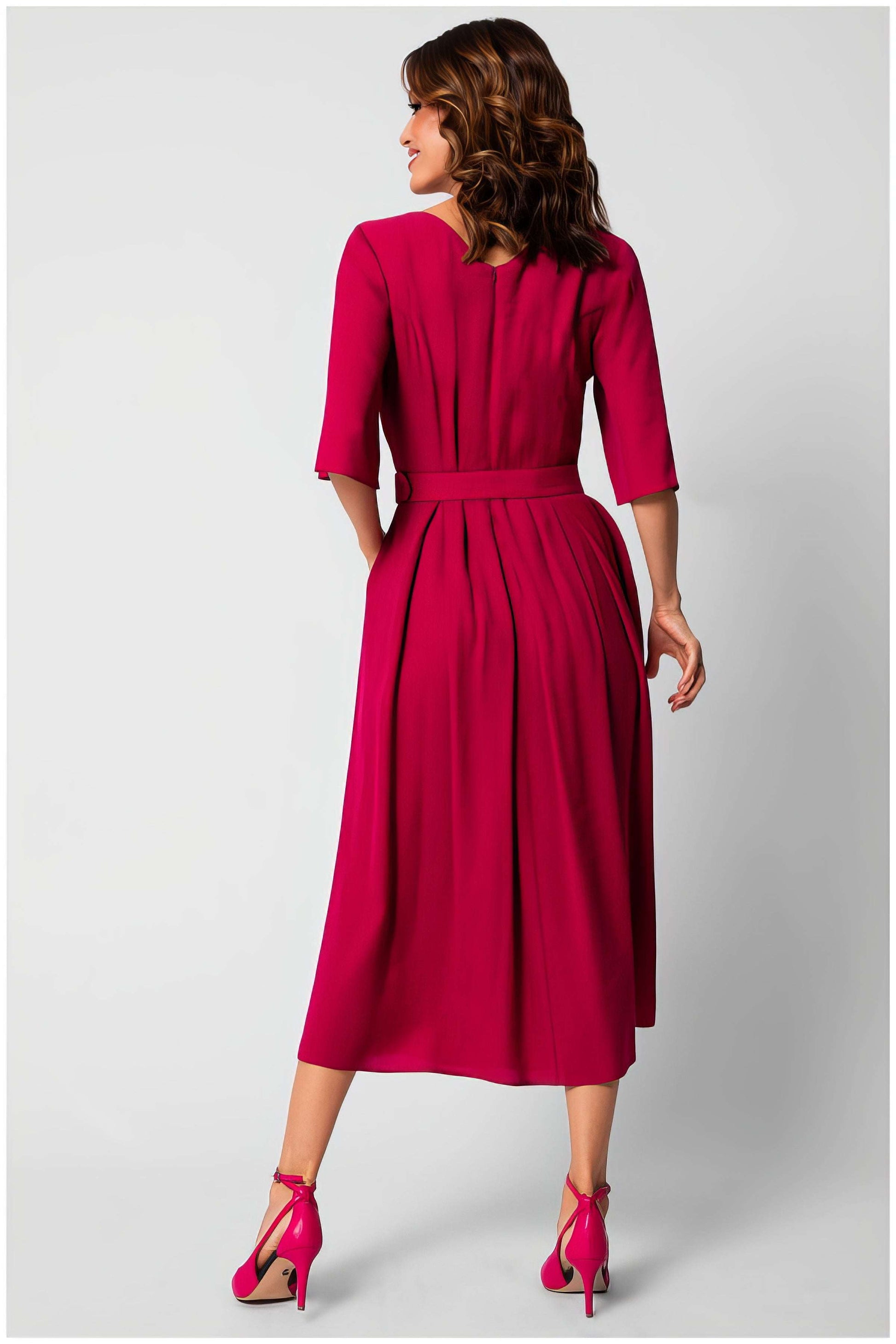 Back view of a woman wearing the Charlotte Elegant Midi Dress in vibrant pink by Luna Fashion House