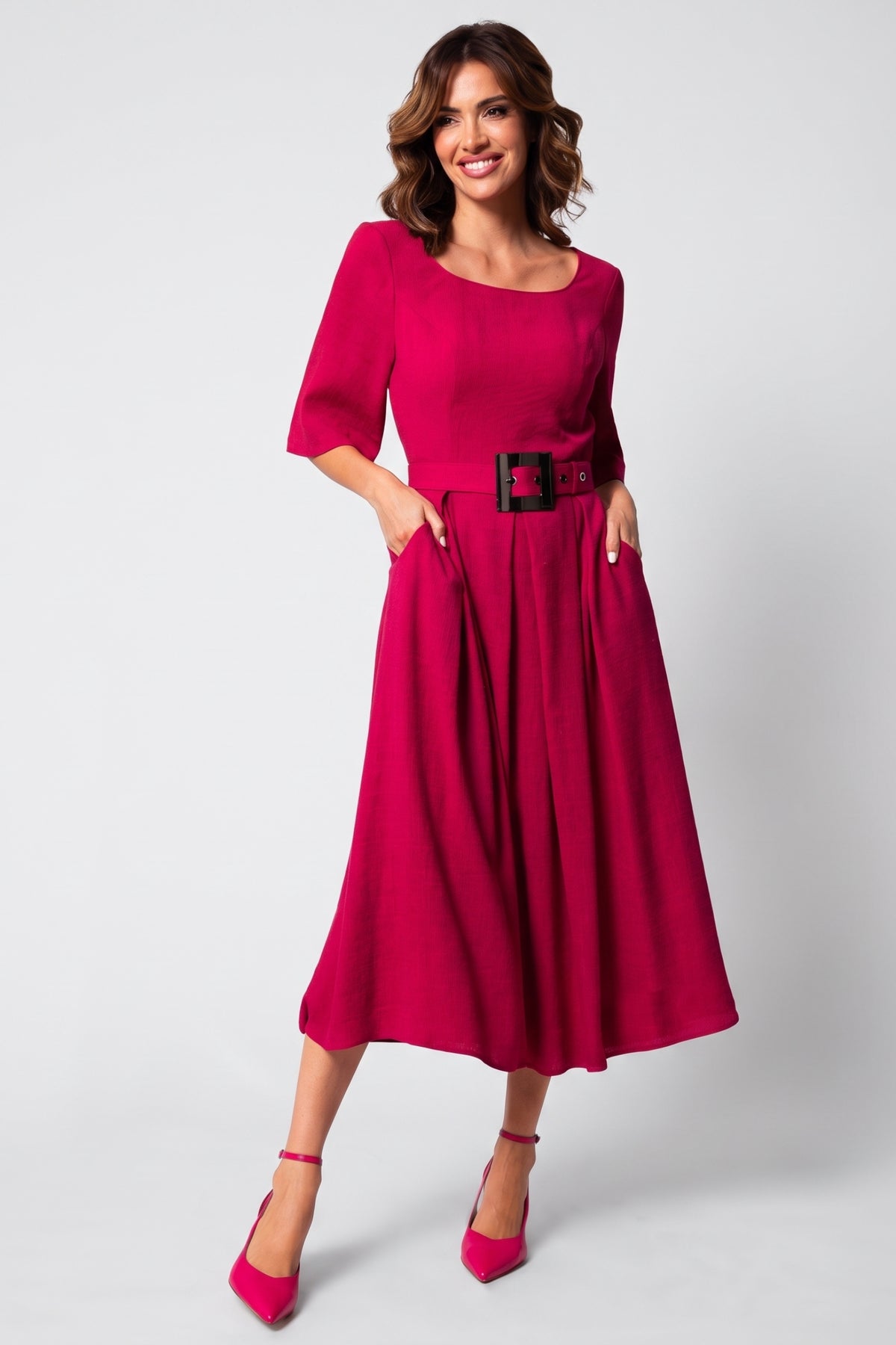 Pink Elegant Midi Dress, Charlotte. Front view on the model, 3/4 sleeves and a buckle belt.