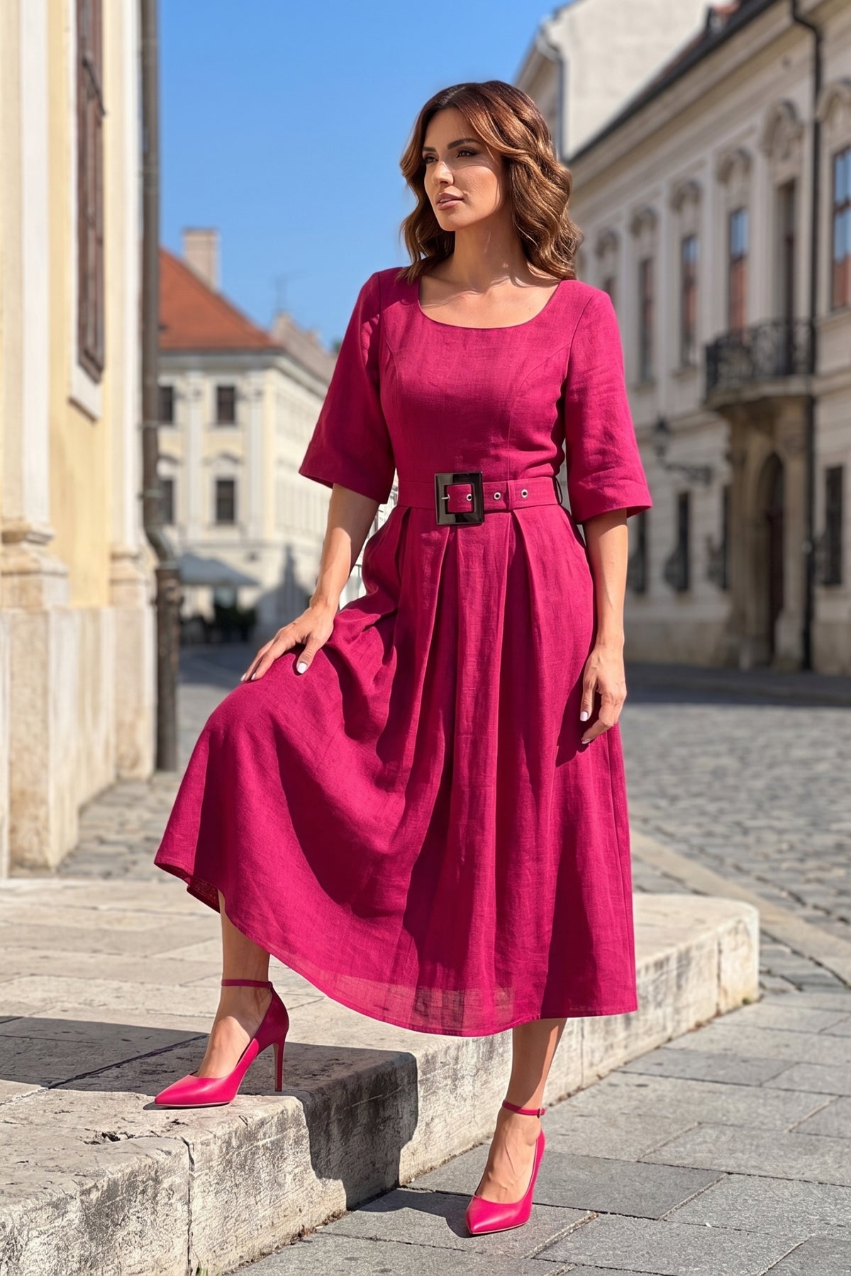Pink Elegant Midi Dress, Charlotte. Worn with pink heels in a city square.