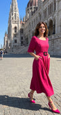 Pink Elegant Midi Dress, Charlotte. Worn in front of a historic building.