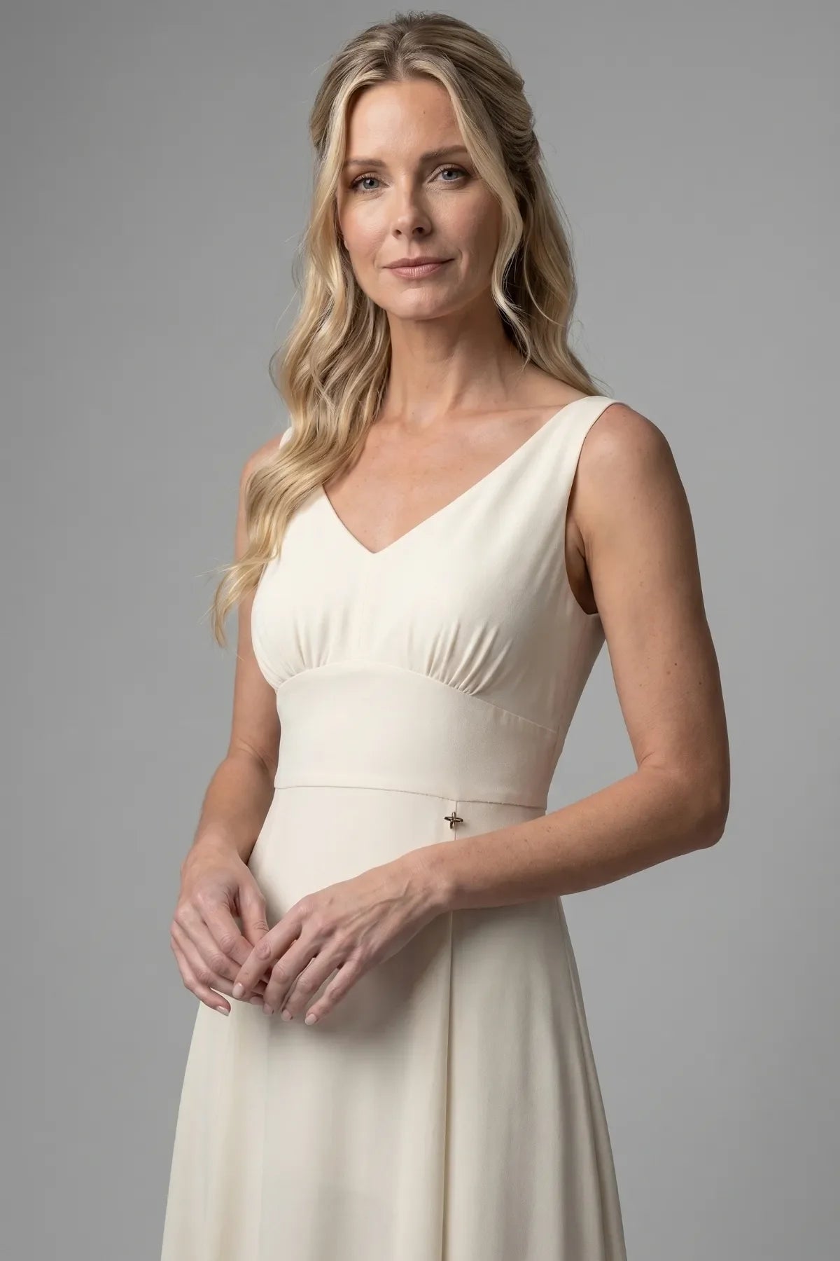 Detail of the Rebeka V neckline, gathered empire bodice and slim waist belt in ivory