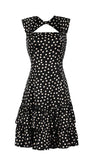 Black satin ruffle satin dress, sleeveless with ivory polka dots, fitted bodice, cutout neckline, and tiered ruffle hem