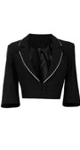 Rina Cropped Blazer in black with white piping detail and three-button closure showcasing modern tailored design.