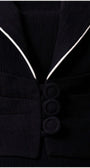Close-up of the Rina Cropped Blazer showing textured fabric, three fabric-covered buttons, and contrasting white trim on collar.