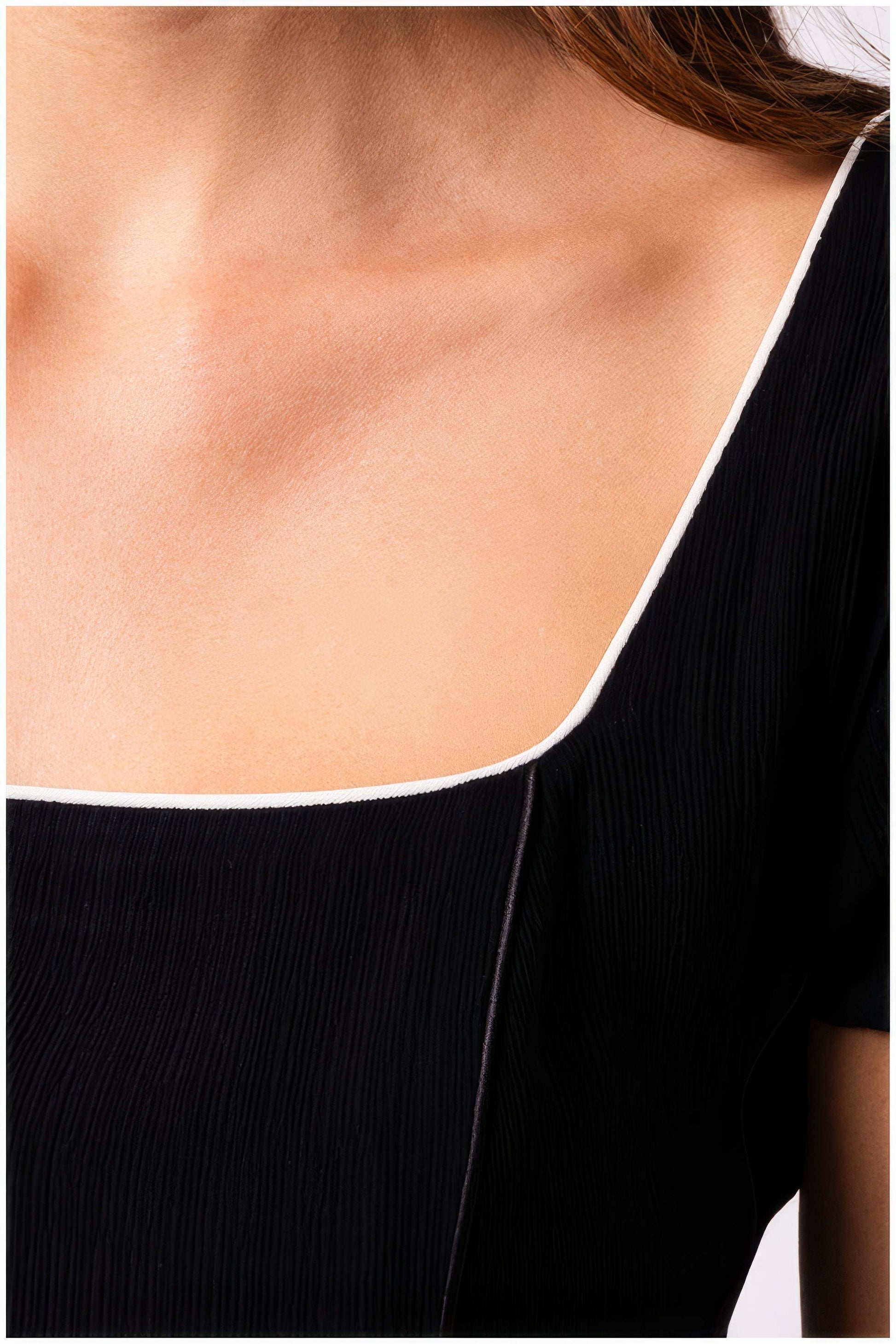 Close-up detail of the neckline on the Rina Elegant Midi Dress in Black by Luna Fashion House