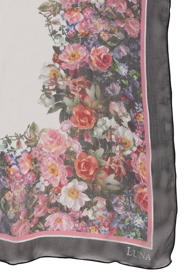 Silk scarf with vibrant silk floral scarf print and contrasting border, elegant and lightweight for versatile styling.
