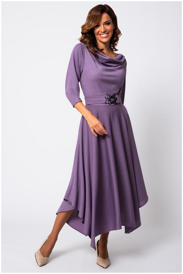 Woman wearing a purple dress with a belt on a white background