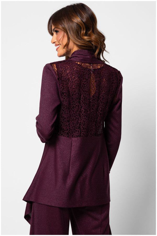 Woman wearing bordeaux lace cardigan Jody with lace back detail and long sleeves, styled with matching pants against white background
