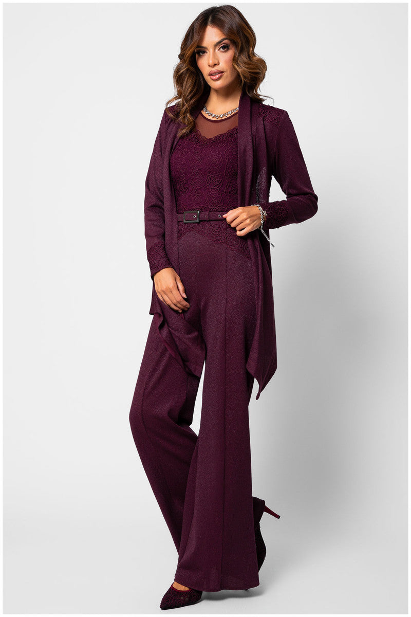 Woman wearing a burgundy jumpsuit with a matching jacket on a white background