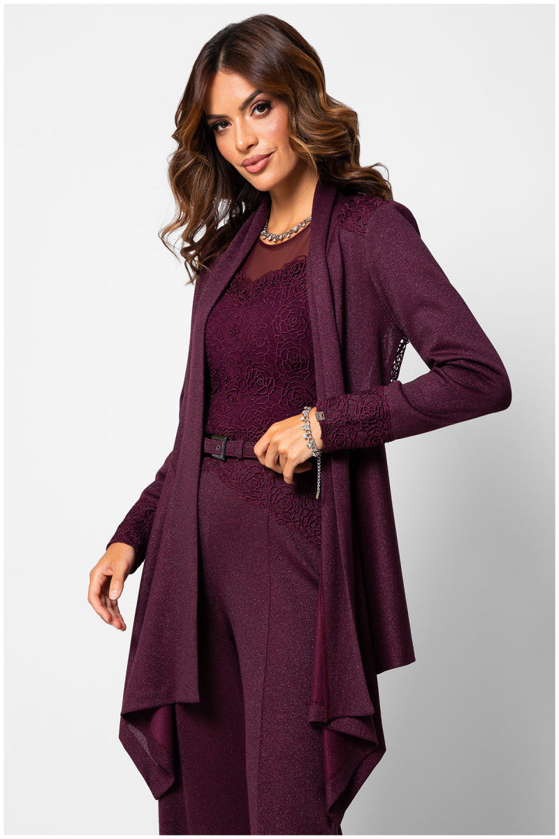 Woman wearing a burgundy dress with matching coat on a white background